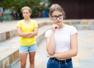 Fototapeta premium Girl was offended by the girlfriend after quarrel on the street