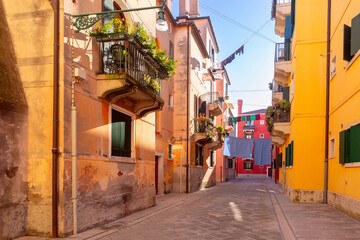 Naklejka premium A vibrant alley with colorful buildings in the Canareggio District, Venice, Italy