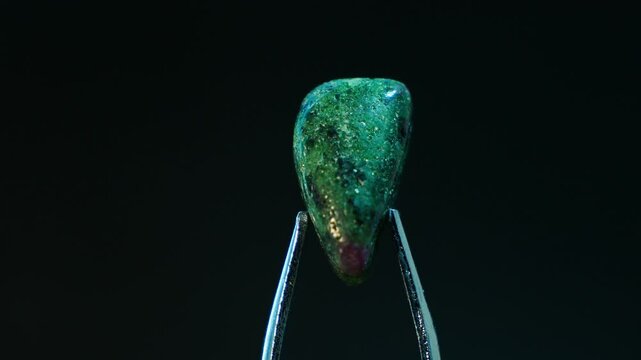 Close-up of Ruby in Zoisite, striking combination of ruby crystals in green zoisite. Contrast between the red rubies and green zoisite, showcasing its ornamental and jewelry use. Ideal for geological
