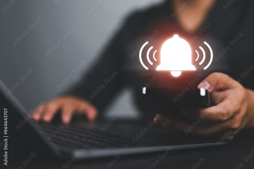 Poster Man Hand hold smartphone and press the button of Notification bell button on smartphone app screen close up,App Notification on Smart Phone Screen, Remote online alerts, home security signal.