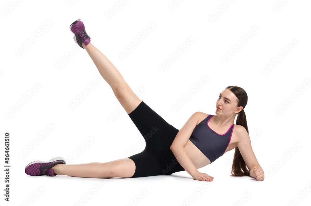 Wall mural Young woman doing aerobic exercise on white background