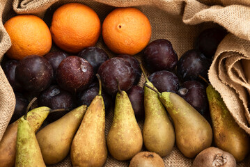 Fresh pears, satsumas, plums and kiwis