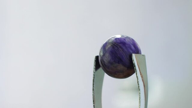 Charoite(Lilac Stone) striking purple hues and unique patterns. Chemical formula: K(Ca,Na)2Si4O10(OH,F)xH2O. Hardness 5-6. Composed of potassium, calcium, sodium silicate. Valued for transformation