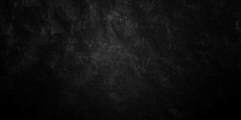 Abstract black stone wall texture grunge rock surface. dark gray background backdrop. wide panoramic banner. old wall stone for dark black distressed grunge background wallpaper rough concrete wall.