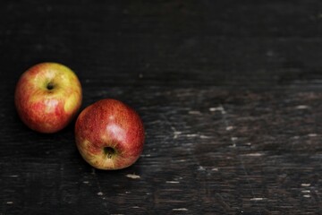 Two apples, fruit, on a black background, free space, place for text, top view, copy space, horizontal