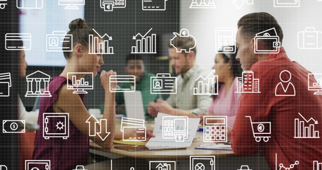 Image of multiple icons over diverse coworkers discussing reports in office