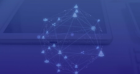 Image of connected dots forming globe over overhead view of digital tablet and laptop on table