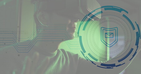 Obraz premium Image of envelope in shield and loading circles, biracial man using vr headset