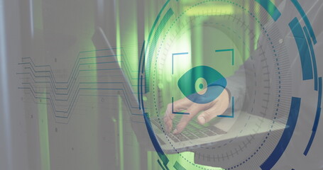 Image of iris scanner against mid section of male engineer using laptop at computer server room