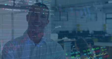 Image of stock market data processing over portrait of caucasian man smiling at office