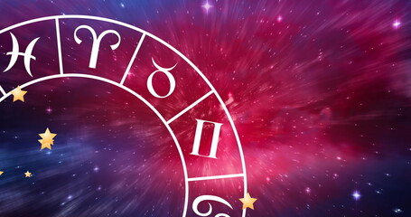 Image of zodiac wheel spinning on starry night sky