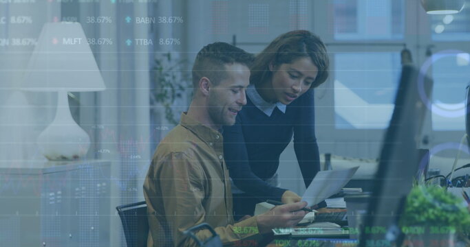 Image of statistical, stock market data processing over diverse man woman discussing at office
