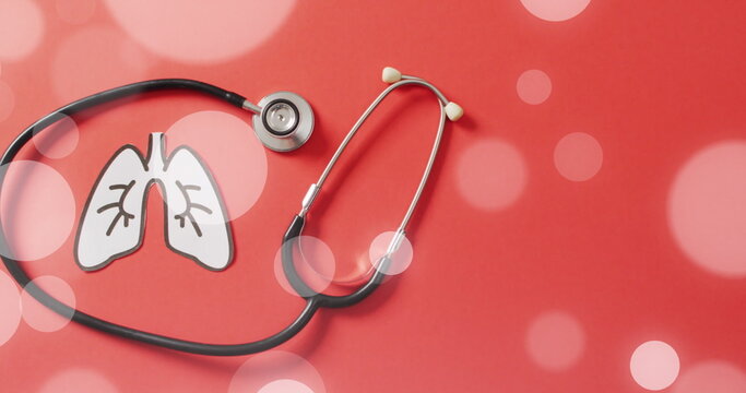 Image of spots over lungs and stethoscope