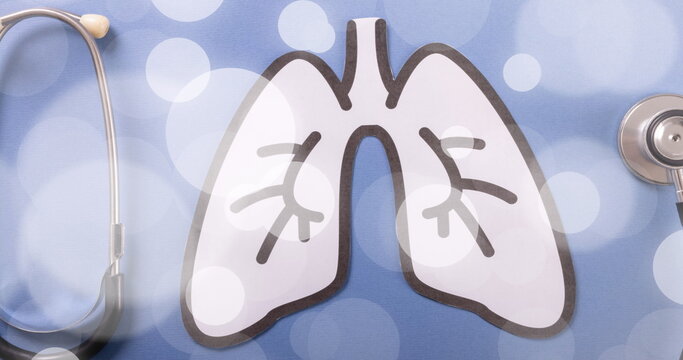 Image of spots over lungs and stethoscope