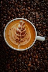 Beautiful latte, coffee beans background, in a cozy coffee shop