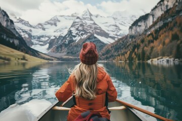 serene young woman canoeing on mirrorlike mountain lake majestic snowcapped peaks reflected in crystalclear waters embodying harmony with nature