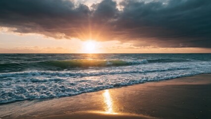 Obraz premium beach with waves coming in to the shore and the sun shining through the clouds