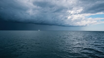 Fototapeta premium large body of water with clouds in the sky and a boat in the water