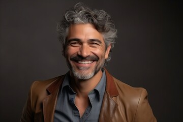 Fototapeta premium Portrait of a handsome middle-aged man smiling at the camera