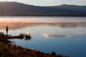 Man Fishing on Lake