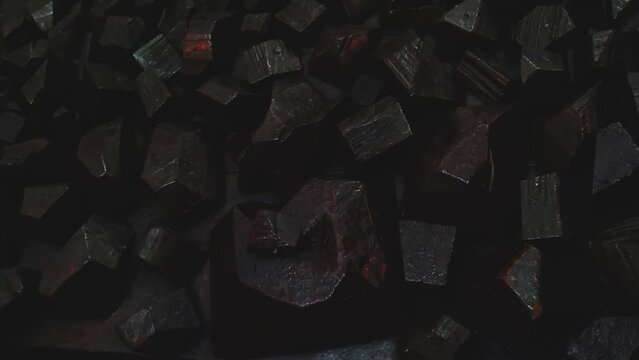 The gypsum wall surface is made in the form of a black rocky stone. Gloomy interior design.