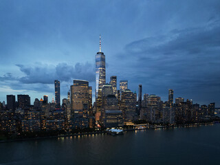 Obraz premium NYC aerial night view. New York City skyline, cityscape of Manhattan in USA. New York City NYC Manhattan Downtown Skyline, from Jersey City USA.