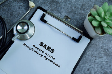 Concept of SARS - Severe Acute Respiratory Syndrome write on paperwork isolated on wooden...