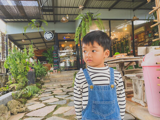 Portrait of a smiling boy, embodying joy and childhood happiness indoors
