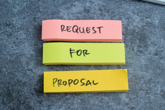 Concept of Request for Proposal write on sticky notes isolated on Wooden Table.