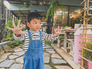 Portrait of a smiling boy, embodying joy and childhood happiness indoors