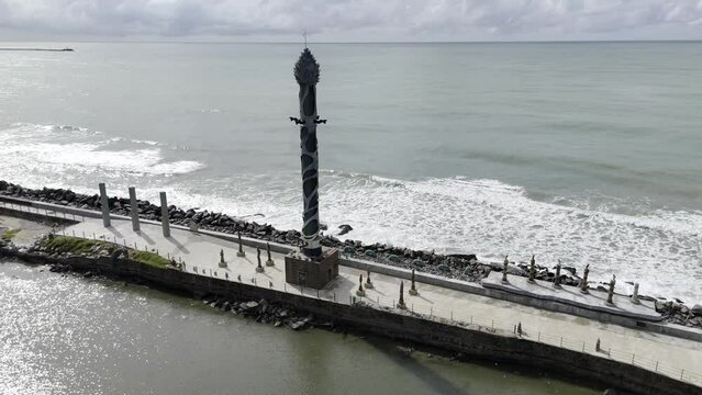 Drone orbits to the right around Torre de Cristal, a tower by Francisco Brennand at the Sculptures Park in Recife, Brazil