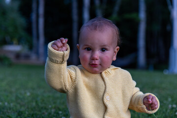 Toddler girl outside at dusk 