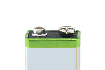 Close-up view of a 9-volt battery showing positive and negative terminals