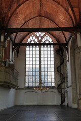 Amsterdam Oude Kerk Church Interior Detail with Wooden, Ceiling, Window and Chandelier, Netherlands