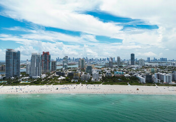 Obraz premium Miami beach, ocean drive summer cityscape. Miami Beach, South Beach, Florida, USA. Coastline, aerial view. Aerial view of high skyscrapers and ocean, Miami Beach, Florida, United States.