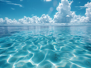 a beautiful view of the ocean. The water appears calm and blue, with a few clouds in the sky. 