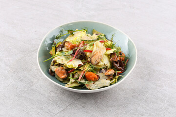 Salad with mussels and nut sauce for the restaurant menu