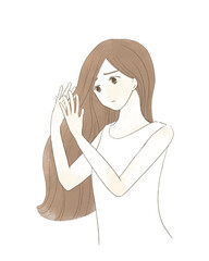 髪のダメージに悩む女性