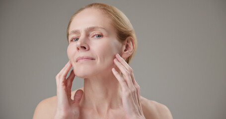 Anti age, Beauty, health and dry skin care concept - beautiful middle-aged mature Caucasian woman...