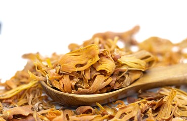 Closeup of Mace or Nutmeg Aril in a Wooden Spoon Isolated on White Background with Copy Space, Also Known as Javitri or Myristica Fragrans in Horizontal Orientation