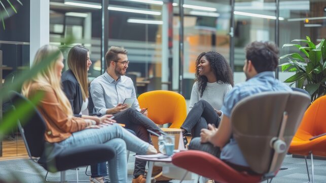 Coworkers sitting in the office and chatting. AIG535