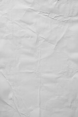 Vertical white crumpled paper poster texture background