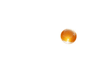 A glowing orange orb with a slight halo, isolated on a black background.  Perfect for science fiction, fantasy, or futuristic designs.
