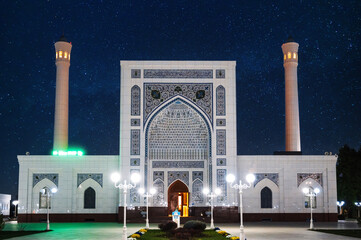 white Islamic Masjid Minor Mosque in Tashkent in Uzbekistan on background of night blue starry sky...