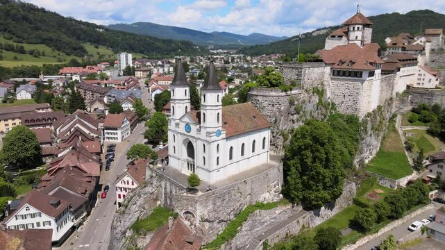 Spiraling drone shot around evangelical church and castle in Aarburg Switzerland