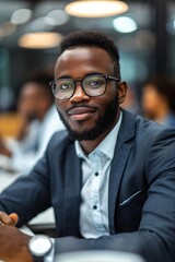 Obraz premium Confident african american businessman smiling in office meeting