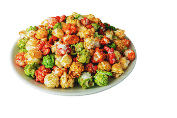 A rainbow of sweet popcorn in a plate on a white background