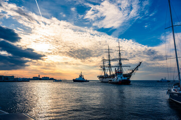 Fototapeta premium Historic city of Trieste. Between ancient buildings and reflections on the sea. Autumn day and celebration of the Barcolana International Regatta.