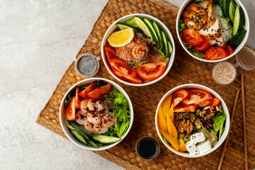 Fresh poke bowl on straw mat close up
