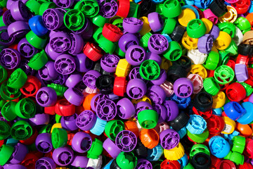 Plastic lids. Lots of colorful caps. Industry, ecology, plastic processing